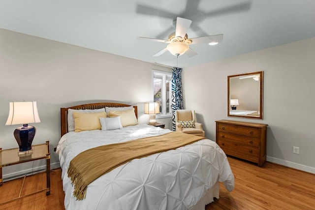 bedroom featuring ceiling fan and light hardwood / wood-style flooring