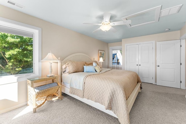 bedroom with ceiling fan, a closet, and carpet flooring