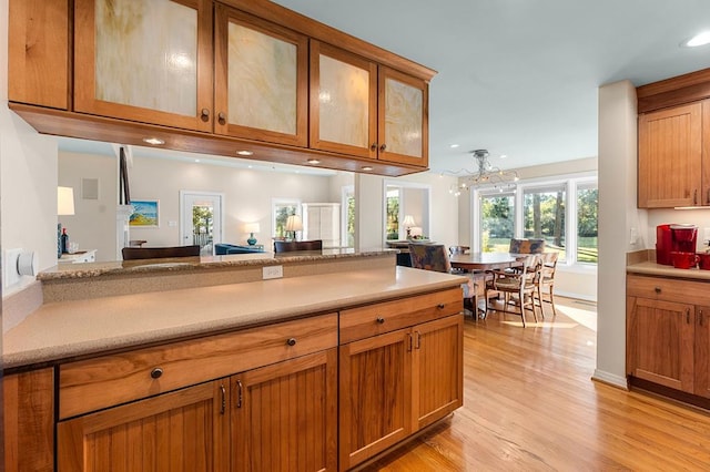 kitchen featuring light hardwood / wood-style floors and an inviting chandelier