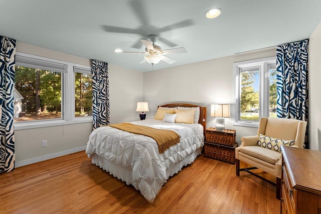 bedroom featuring light wood-type flooring and ceiling fan