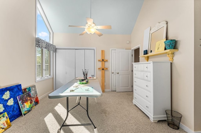 game room featuring ceiling fan, vaulted ceiling, and light carpet