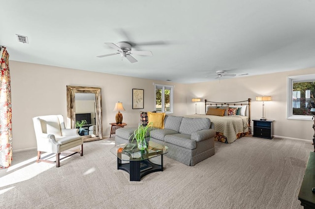 carpeted bedroom featuring ceiling fan