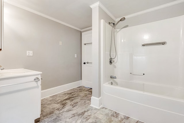 full bath featuring baseboards, marble finish floor, crown molding, vanity, and tub / shower combination