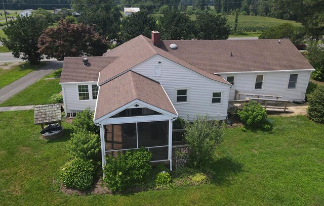 15073 Richmond Rd, Callao, VA 22435 - rear view of house with a yard, a sunroom, a chimney, and roof with shingles