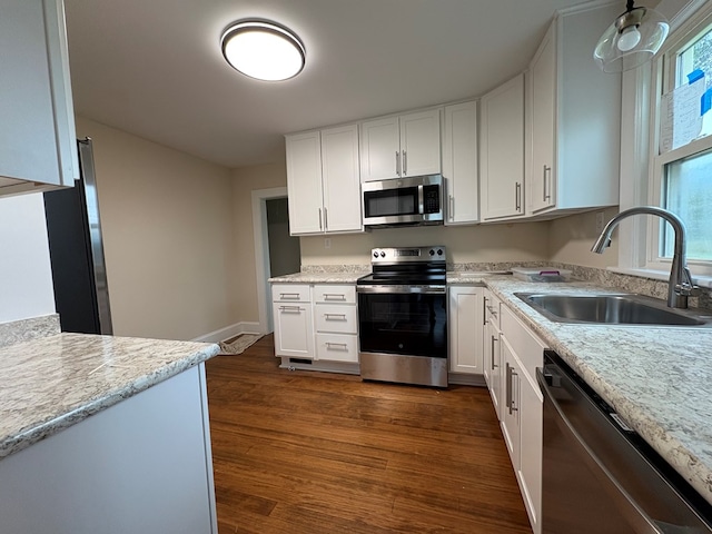 15073 Richmond Rd, Callao, VA 22435 - kitchen featuring appliances with stainless steel finishes, white cabinets, and dark wood-type flooring