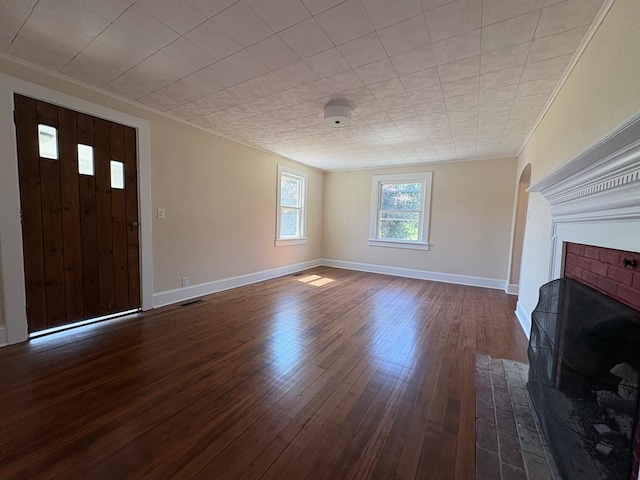 15073 Richmond Rd, Callao, VA 22435 - unfurnished living room with a brick fireplace and dark wood finished floors