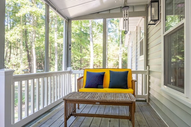 sunroom featuring vaulted ceiling