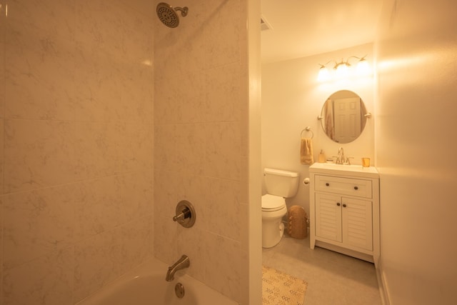 full bathroom with vanity, tiled shower / bath combo, and toilet