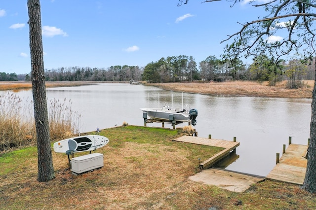 dock area featuring a lawn, a water view, and boat lift