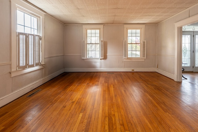 spare room featuring light hardwood / wood-style floors