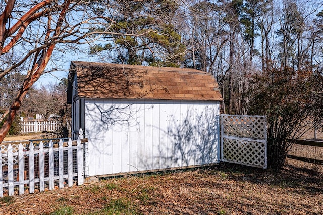 view of gate with a shed