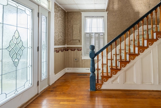 entryway with hardwood / wood-style floors