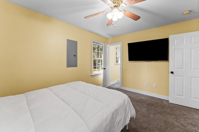 bedroom featuring electric panel, ceiling fan, and dark colored carpet