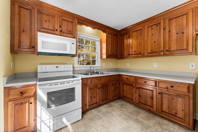 kitchen with white appliances and sink