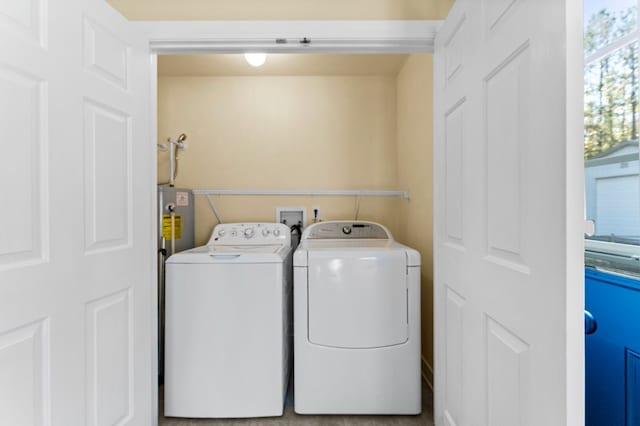 laundry area featuring washing machine and clothes dryer