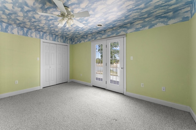325 Cat Point Dr, Warsaw, VA 22572 - unfurnished bedroom with access to exterior, baseboards, carpet, and a ceiling fan