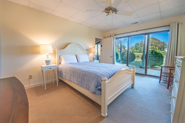 181 Cross St, Urbanna, VA 23175 - carpeted bedroom with access to exterior, a paneled ceiling, and a ceiling fan