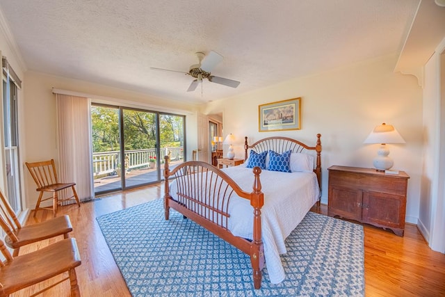181 Cross St, Urbanna, VA 23175 - bedroom with access to outside, light wood-style flooring, a textured ceiling, ornamental molding, and ceiling fan