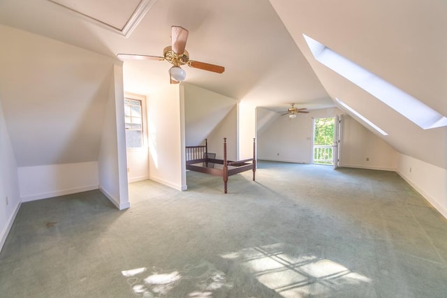 181 Cross St, Urbanna, VA 23175 - additional living space with a skylight, ceiling fan, vaulted ceiling, and carpet flooring