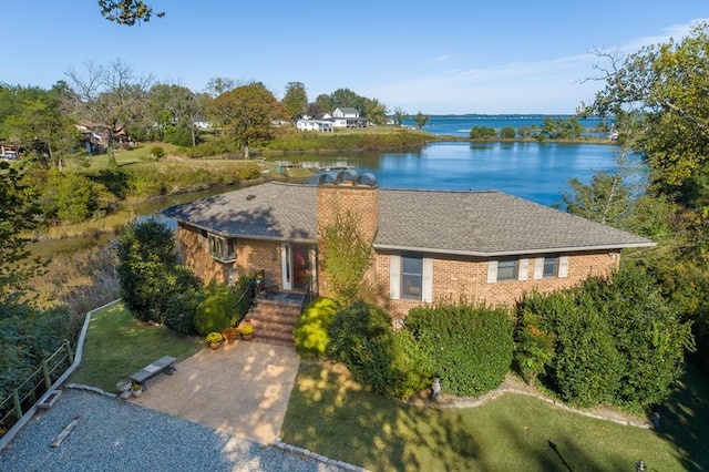 181 Cross St, Urbanna, VA 23175 - single story home featuring a water view, brick siding, a front yard, and a chimney