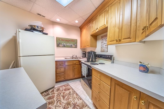181 Cross St, Urbanna, VA 23175 - kitchen with white appliances, light countertops, a drop ceiling, and recessed lighting