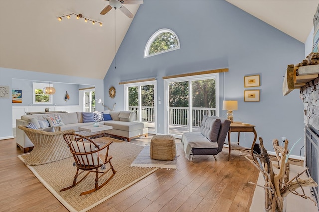 1198 Knights Landing Dr, Heathsville, VA 22473 - living area featuring high vaulted ceiling, a ceiling fan, hardwood / wood-style flooring, plenty of natural light, and a fireplace