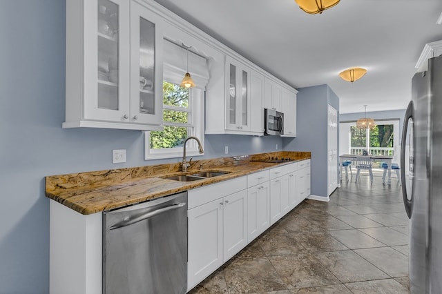 1198 Knights Landing Dr, Heathsville, VA 22473 - kitchen with appliances with stainless steel finishes, a sink, white cabinetry, hanging light fixtures, and plenty of natural light