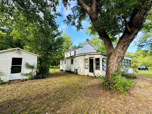 view of property exterior featuring a lawn