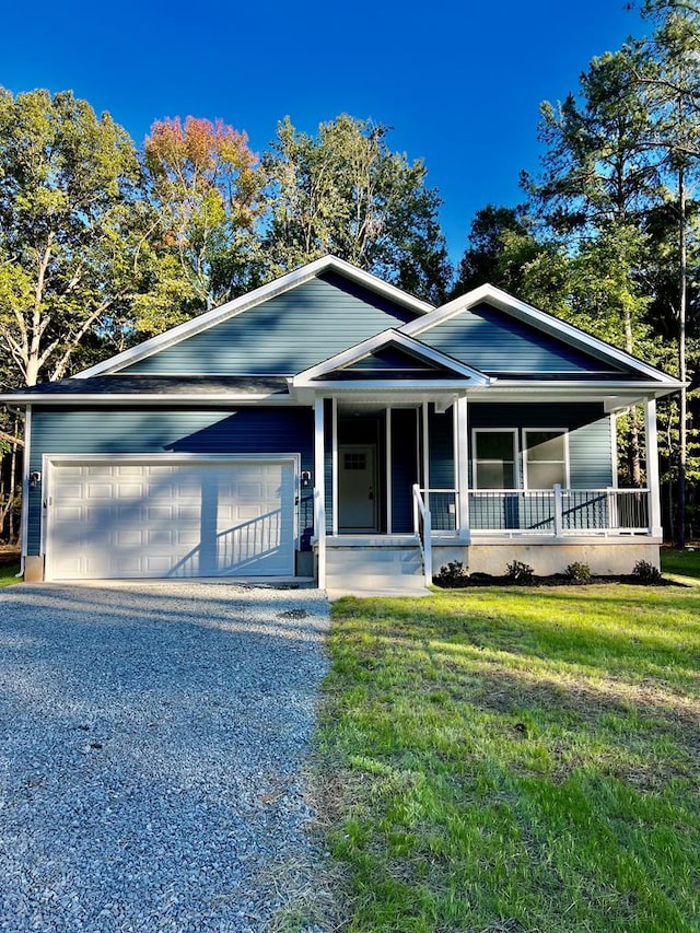 94 Dingley Rd, Va, VA 22520 - view of front of home with a garage, a porch, a front yard, and gravel driveway