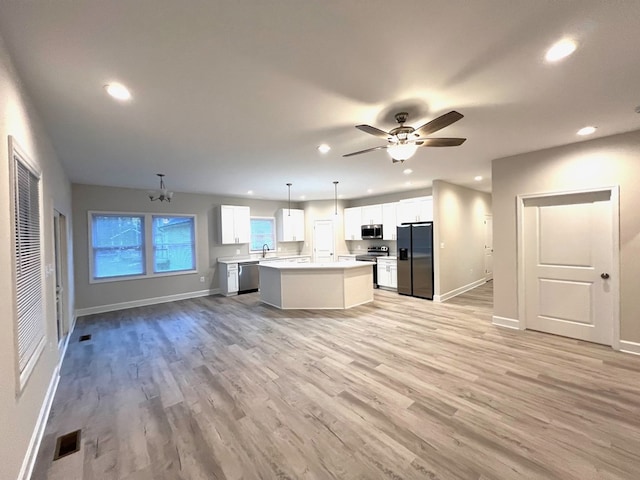 94 Dingley Rd, Va, VA 22520 - kitchen with stainless steel appliances, recessed lighting, open floor plan, a center island, and light wood-type flooring