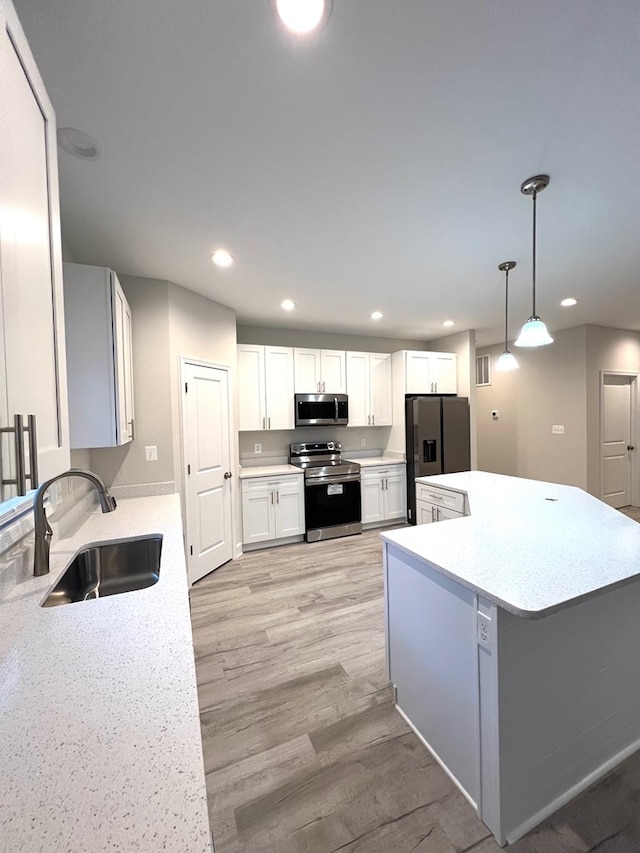 94 Dingley Rd, Va, VA 22520 - kitchen featuring stainless steel appliances, recessed lighting, light countertops, light wood-type flooring, and white cabinetry