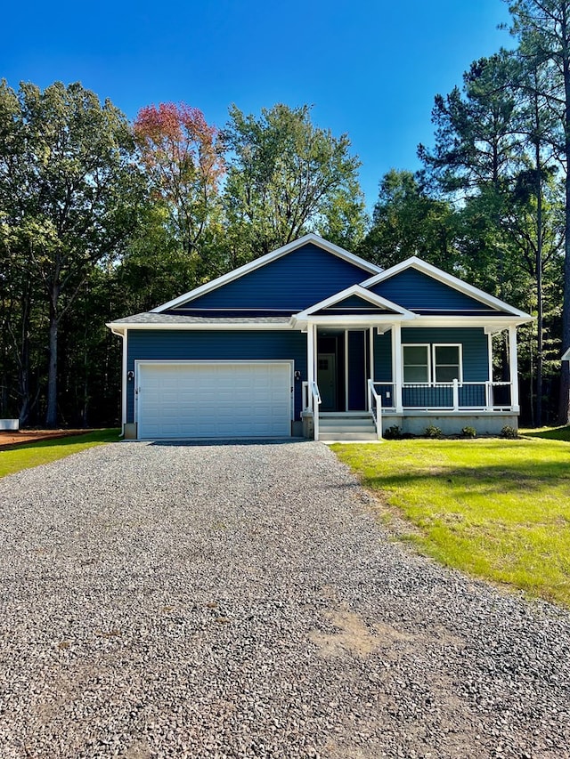 94 Dingley Rd, Va, VA 22520 - single story home featuring gravel driveway, an attached garage, a porch, and a front lawn