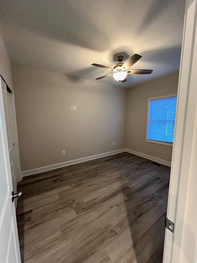 94 Dingley Rd, Va, VA 22520 - empty room featuring dark wood finished floors, a ceiling fan, and a textured ceiling