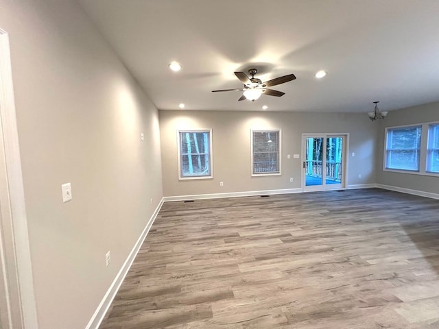 94 Dingley Rd, Va, VA 22520 - spare room featuring recessed lighting, wood finished floors, a ceiling fan, and a chandelier