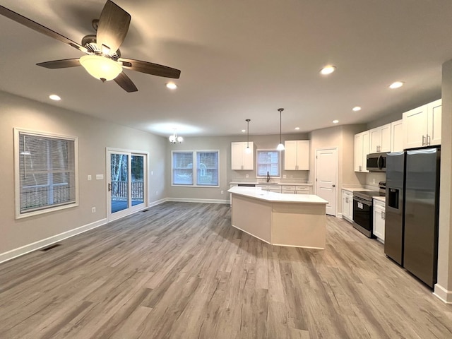 94 Dingley Rd, Va, VA 22520 - kitchen with appliances with stainless steel finishes, light wood-type flooring, white cabinetry, light countertops, and recessed lighting