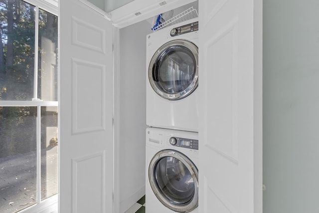 laundry room with stacked washer and dryer