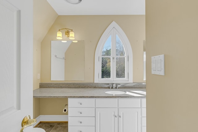 bathroom with tile patterned flooring and vanity