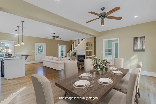 dining room featuring ceiling fan and light wood-type flooring