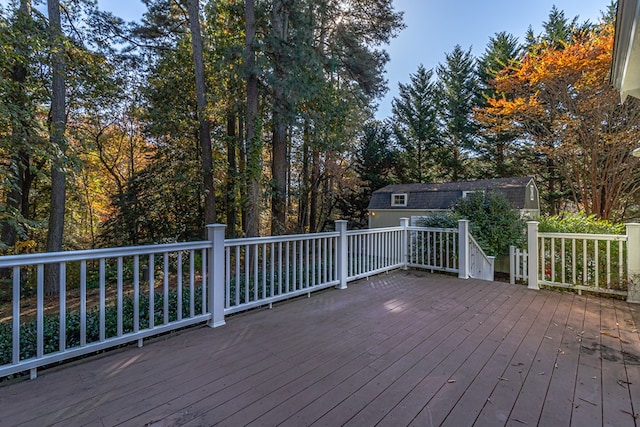 wooden terrace with a storage unit