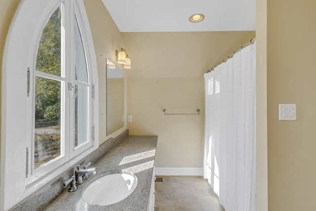 bathroom with vanity and tile patterned flooring