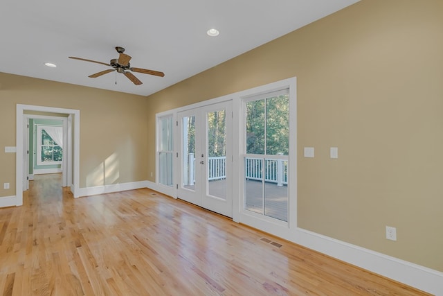 empty room with a healthy amount of sunlight and light hardwood / wood-style floors