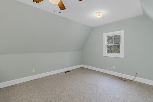 bonus room featuring vaulted ceiling, carpet flooring, and ceiling fan