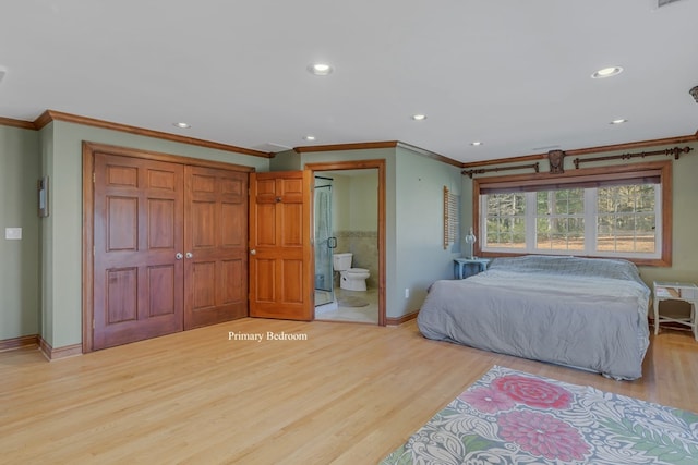 bedroom with ensuite bathroom, ornamental molding, and light wood-type flooring