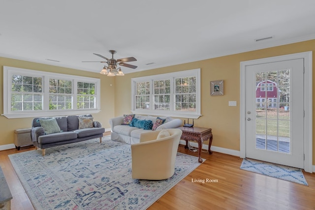 living room with ceiling fan and hardwood / wood-style floors