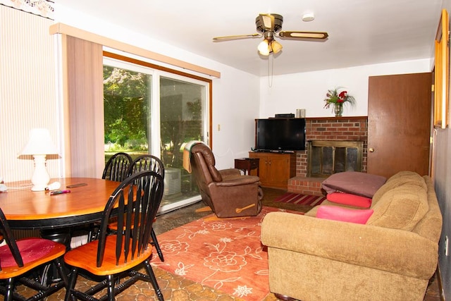 203 Lampkintown Rd, Burgess, VA 22432 - living room featuring ceiling fan, a fireplace, and a baseboard heating unit