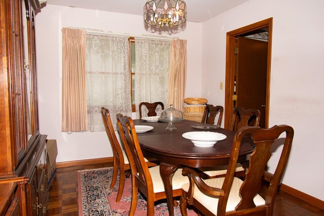 203 Lampkintown Rd, Burgess, VA 22432 - dining room featuring baseboards and a chandelier