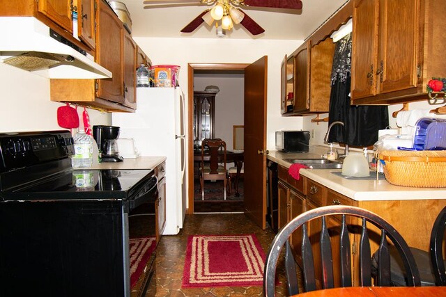 203 Lampkintown Rd, Burgess, VA 22432 - kitchen featuring electric range, under cabinet range hood, ceiling fan, light countertops, and a sink