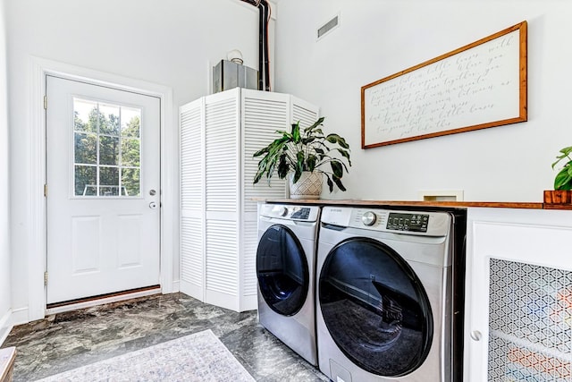 clothes washing area featuring laundry area, visible vents, independent washer and dryer, and marble finish floor