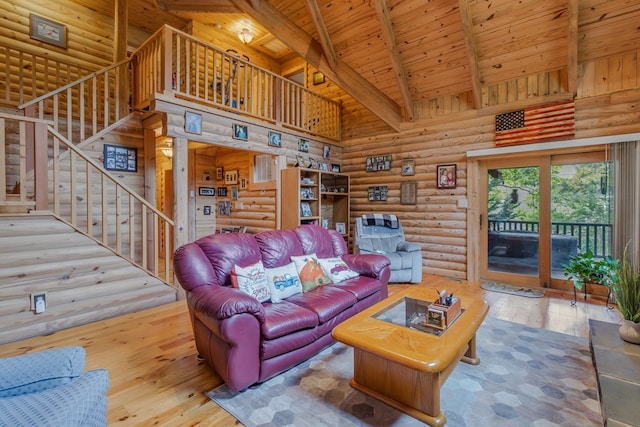 living room with rustic walls, wooden ceiling, beamed ceiling, high vaulted ceiling, and light wood-type flooring