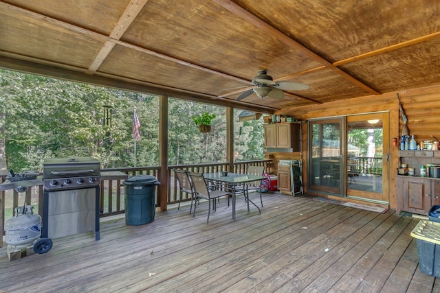 deck with grilling area and ceiling fan